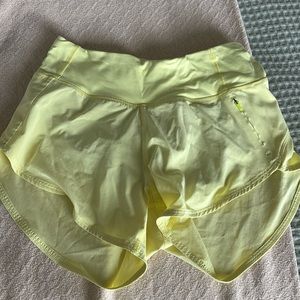 OV yellow running shorts